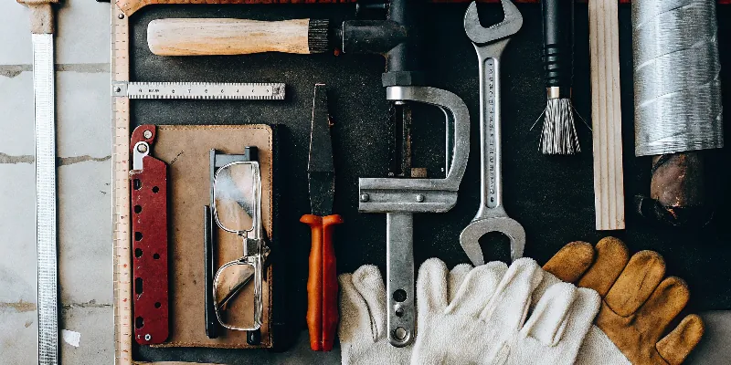 A layout of essential pipe fitting tools